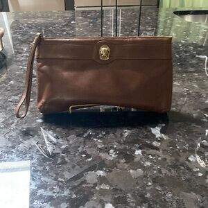 Brown leather clutch slightly used pristine condition